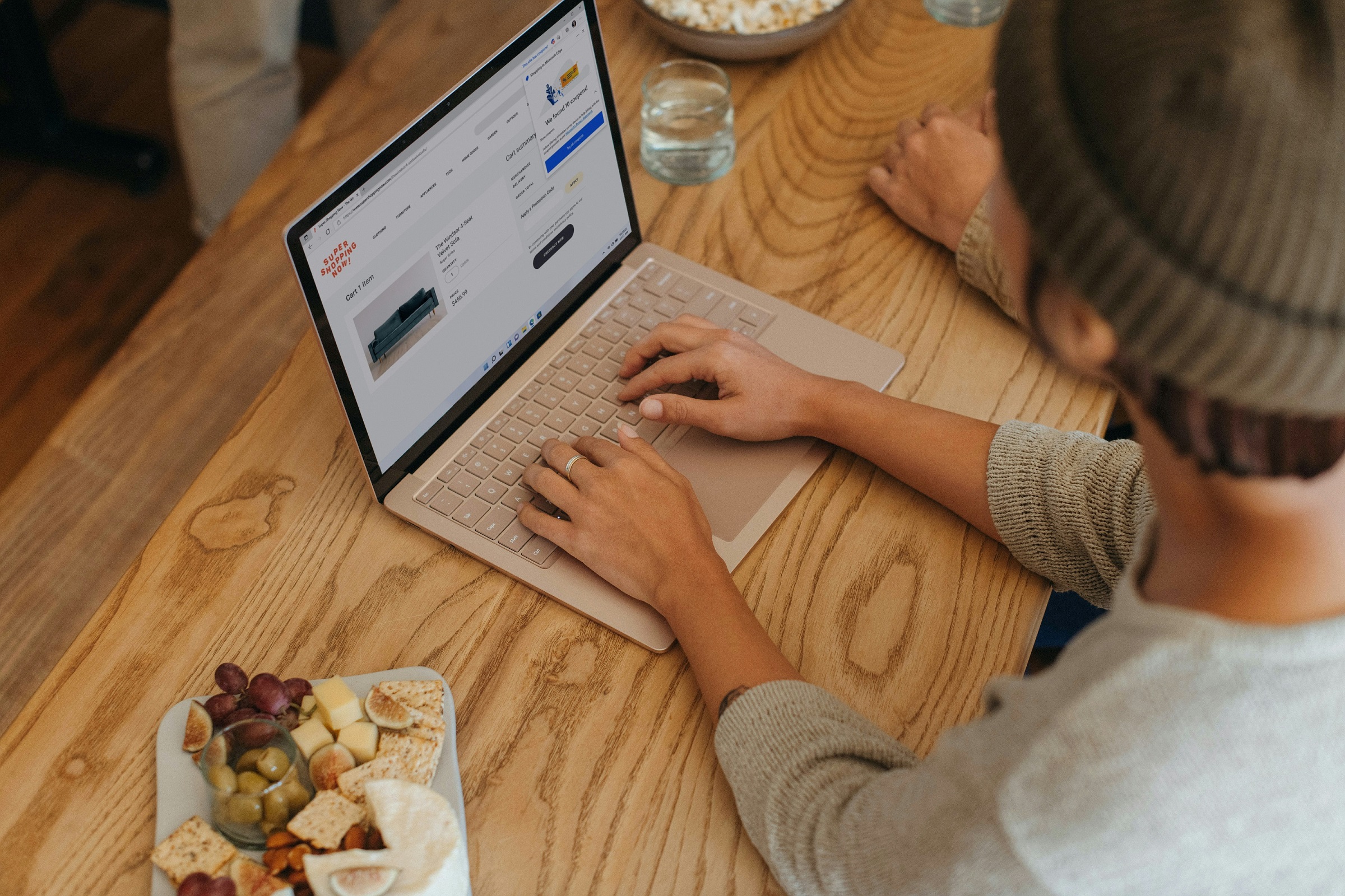 Person typing on a laptop in an office